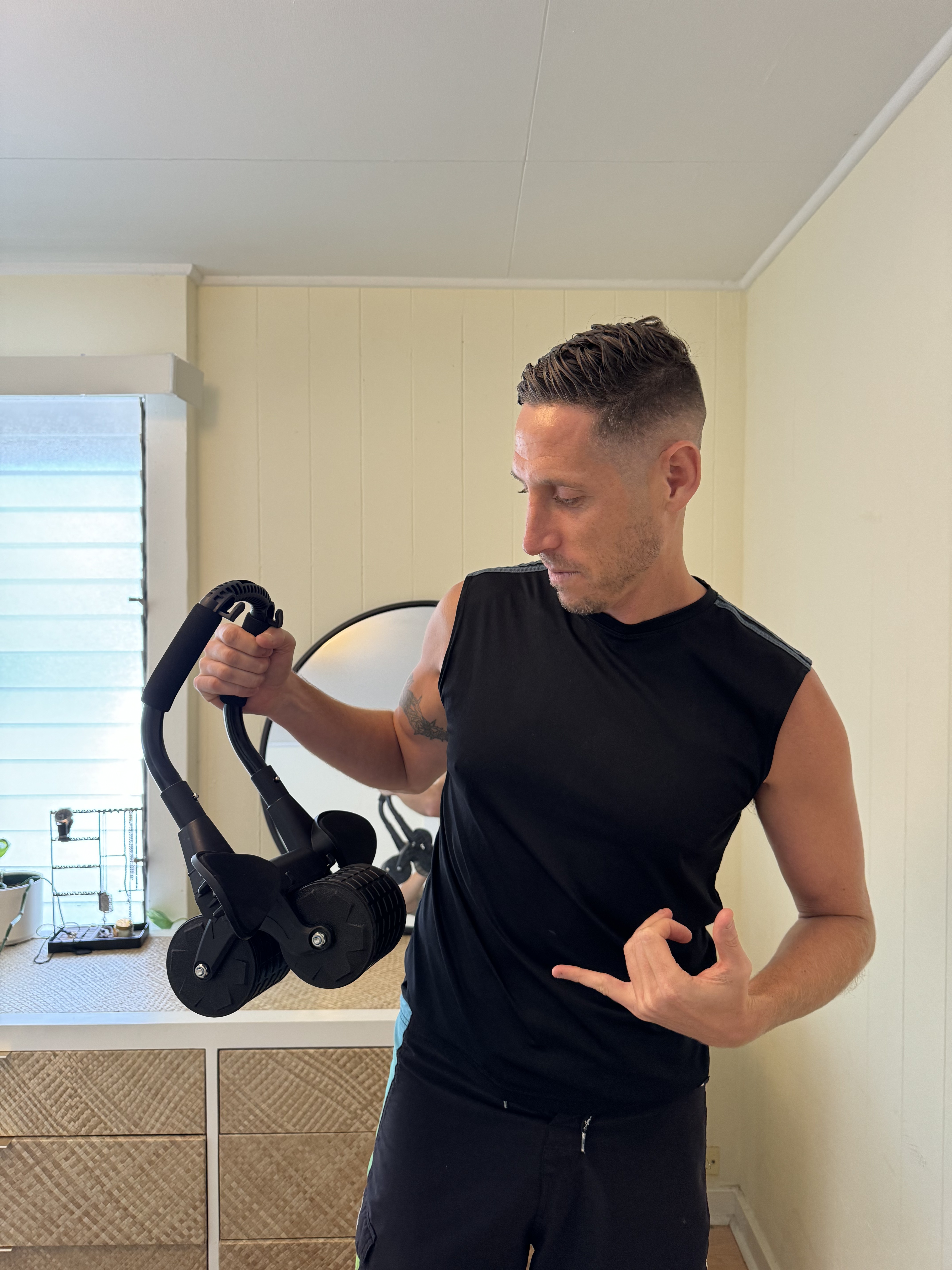 Close up of the PostureFlex Ab Roller in use, showing the padded forearm support and two wide wheels